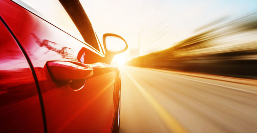 A car driving on a motorway at high speeds, overtaking other cars